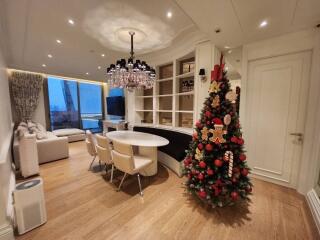 Spacious living room with dining area and decorated Christmas tree