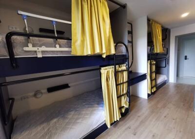 Bedroom with bunk beds and yellow curtains