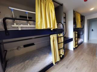 Bedroom with bunk beds and yellow curtains