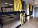 Bedroom with bunk beds and yellow curtains