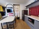 Modern kitchen area with dining table and appliances