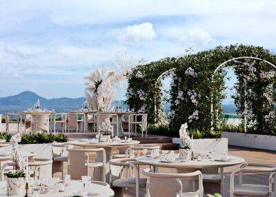 Elegant outdoor dining area with scenic views and decorative arches