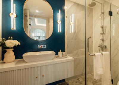 Modern bathroom with glass shower and stylish vanity