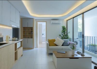 Modern living room with kitchen and balcony access