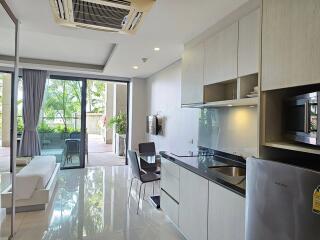 Modern living area and kitchen with outdoor views