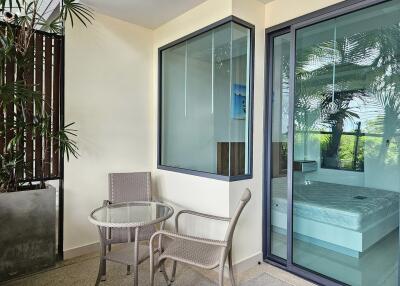 Cozy balcony with a small table and chairs