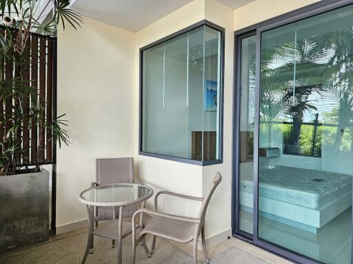 Cozy balcony with a small table and chairs