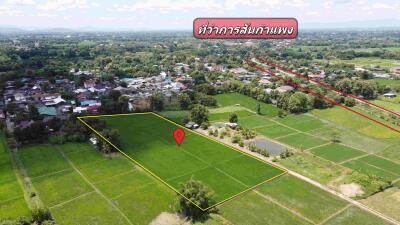 Aerial view of a green plot of land in a rural area