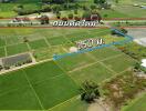 Aerial view of land plots with measurement indication and nearby road