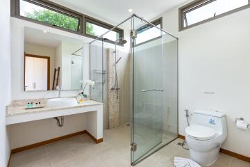 Modern bathroom with glass shower and large windows