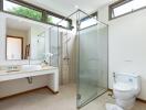 Modern bathroom with glass shower and large windows