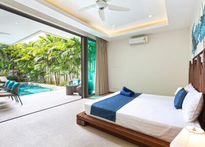 Spacious bedroom with poolside view