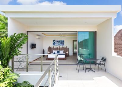 Modern bedroom with balcony and outdoor seating