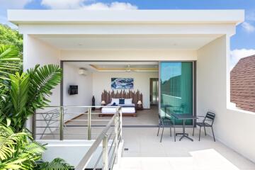 Modern bedroom with balcony and outdoor seating