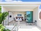 Modern bedroom with balcony and outdoor seating