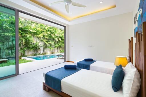 Spacious bedroom with poolside view