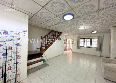 Spacious living room with stairs leading to the upper floor