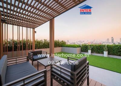 Modern outdoor patio with seating area and city view