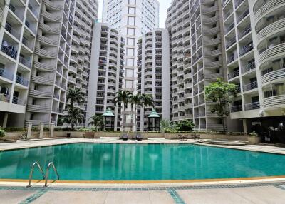 Swimming pool area with surrounding apartment buildings