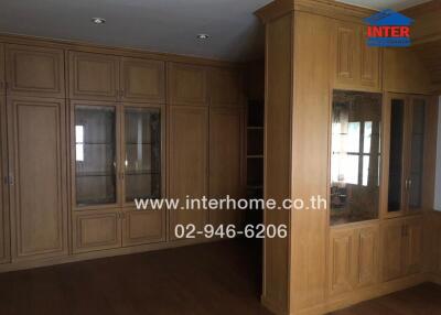 Living room with wooden built-in cabinets