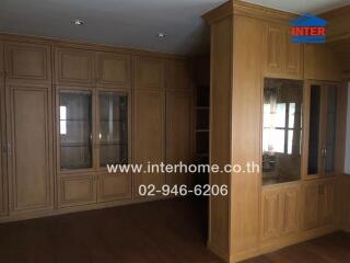 Living room with wooden built-in cabinets