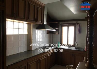 kitchen with wooden cabinets and modern appliances