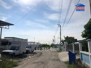 Street view with vehicles and electric poles