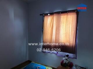 Bedroom with window and curtain