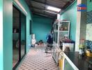 Blue kitchen with tiled floor and glass cabinets