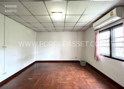 Empty room with wooden floor and large window