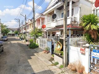 Photo showing the exterior of a residential neighborhood with houses