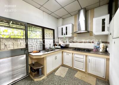 Modern kitchen with built-in cabinets and stainless steel appliances