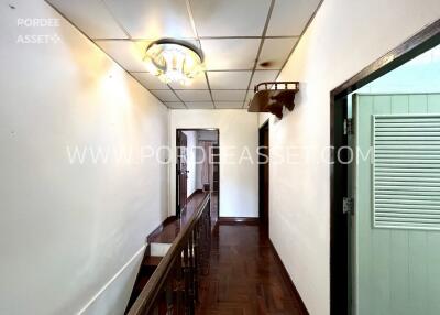 Hallway with wooden flooring and ceiling lights