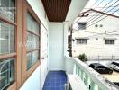 Balcony view with neighboring buildings and electrical wires