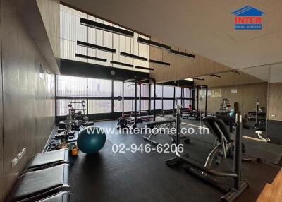 Modern gym facility with various exercise equipment.