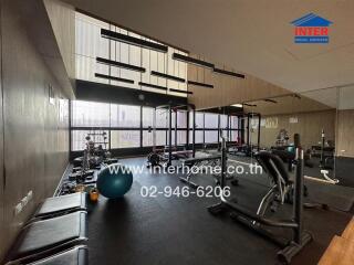 Modern gym facility with various exercise equipment.