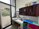 Modern kitchen with sink, cabinets, and patio door