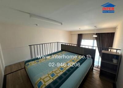 Bedroom with large bed, overhead lighting, and balcony access