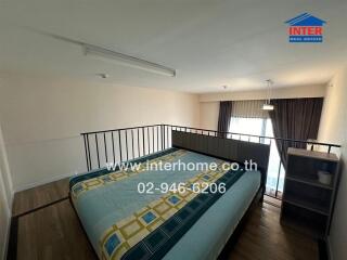 Bedroom with large bed, overhead lighting, and balcony access