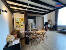 Main living area with dining table and TV