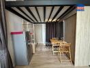 Cozy dining area with wooden furniture and metal shelving