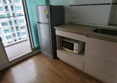 Modern kitchen with wooden flooring and appliances