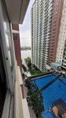 View of high-rise apartment buildings with a pool area