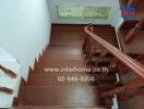 Wooden staircase with railing and stained glass windows