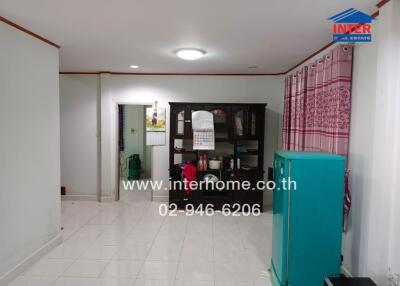 Main living area with furniture and tiled floor