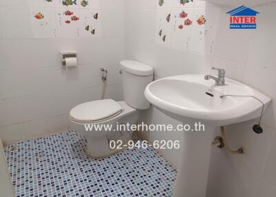 Bathroom with sink, toilet, and tiled floor