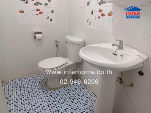 Bathroom with sink, toilet, and tiled floor