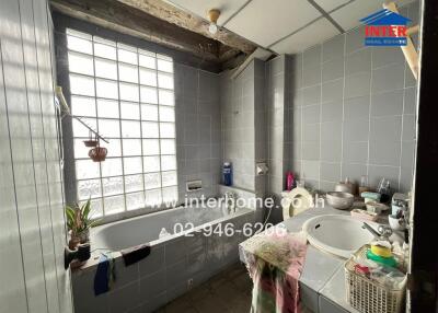 Bathroom with a bathtub and sink