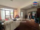 Living room with natural light and various furnishings