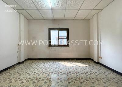 Unfurnished room with window and patterned floor tiles